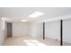 Spacious basement with carpeted floors, painted panel walls and lights at 6582 Malvin Dr, Mableton, GA 30168