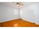 Bedroom with gleaming hardwood floors, a ceiling fan, and two closets for plenty of storage at 6582 Malvin Dr, Mableton, GA 30168