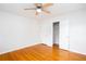 Bedroom with hardwood floors, a ceiling fan, and a closet for storage at 6582 Malvin Dr, Mableton, GA 30168