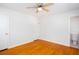 Bedroom with hardwood floors, a ceiling fan, closet and attached bathroom at 6582 Malvin Dr, Mableton, GA 30168