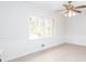 Bedroom features chair railing and natural light at 6582 Malvin Dr, Mableton, GA 30168