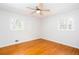 Bedroom featuring hardwood floors, a ceiling fan, and lots of natural light at 6582 Malvin Dr, Mableton, GA 30168