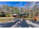 Charming single-story brick home with a cozy carport, a well-maintained lawn, and mature trees at 6582 Malvin Dr, Mableton, GA 30168