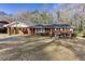 Charming brick home with a covered carport and well-maintained front yard at 6582 Malvin Dr, Mableton, GA 30168