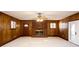 Living room with wood paneling and brick fireplace at 6582 Malvin Dr, Mableton, GA 30168