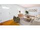 Bright living room with hardwood floors and modern furnishings at 6582 Malvin Dr, Mableton, GA 30168