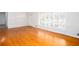 Bright living room with hardwood floors and natural light from large windows at 6582 Malvin Dr, Mableton, GA 30168