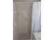 Standard tiled shower stall with white curtain, providing a clean and functional bathing space at 6582 Malvin Dr, Mableton, GA 30168