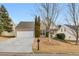 Well-maintained home featuring a tidy front lawn, a two-car garage, and classic architectural design at 6690 Cold Stream Dr, Cumming, GA 30040