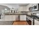 Well-equipped kitchen featuring granite countertops, tiled backsplash, and stainless steel appliances at 6690 Cold Stream Dr, Cumming, GA 30040