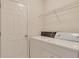 A functional laundry room featuring a washer and dryer, perfect for everyday convenience at 6690 Cold Stream Dr, Cumming, GA 30040