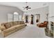 Comfortable living room with a sofa, vaulted ceiling, and fireplace, providing an inviting atmosphere at 6690 Cold Stream Dr, Cumming, GA 30040