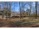 Expansive backyard view showcasing multi-level deck and mature trees at 7690 Classic Way, Atlanta, GA 30350