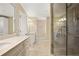 Elegant bathroom with dual sinks, a glass shower, and modern lighting fixtures at 7690 Classic Way, Atlanta, GA 30350