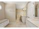 Well-appointed bathroom featuring dual sinks, a walk-in shower, and built-in seating at 7690 Classic Way, Atlanta, GA 30350