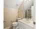 Bathroom with a shower, toilet, and single sink vanity with storage at 7690 Classic Way, Atlanta, GA 30350