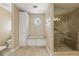 Luxurious bathroom with custom cabinets, and a glass shower with a bench at 7690 Classic Way, Atlanta, GA 30350