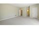 Large bedroom with neutral walls, carpet, and access to ensuite bath and closet at 7690 Classic Way, Atlanta, GA 30350