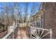 Beautiful outdoor deck with white railings overlooking wooded backyard at 7690 Classic Way, Atlanta, GA 30350