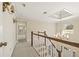 Bright hallway with chandelier and stairway with wooden handrail at 7690 Classic Way, Atlanta, GA 30350