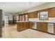 Open kitchen with stainless appliances, granite countertops, and hardwood floors at 7690 Classic Way, Atlanta, GA 30350