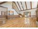 Open living room featuring vaulted ceilings, a staircase, and hardwood floors at 7690 Classic Way, Atlanta, GA 30350