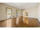 Elegant living room with hardwood floors and large windows offering scenic views at 7690 Classic Way, Atlanta, GA 30350