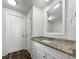 Clean bathroom with a granite vanity, large mirror, and walk-in shower at 8072 Crystal Ln, Douglasville, GA 30134