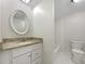 This refreshed bathroom features a granite-topped vanity and tiled shower and flooring at 8072 Crystal Ln, Douglasville, GA 30134