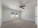 Bright bedroom boasts fresh paint, plush carpet, and natural light from the windows at 8072 Crystal Ln, Douglasville, GA 30134