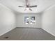 Spacious bedroom featuring neutral-colored walls, carpet, and a ceiling fan at 8072 Crystal Ln, Douglasville, GA 30134