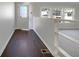 Well-lit entry way with wood flooring and a half wall partition at 8072 Crystal Ln, Douglasville, GA 30134