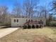 Charming single-story home with a front porch and a well-maintained yard at 8072 Crystal Ln, Douglasville, GA 30134