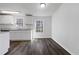 Bright kitchen with white cabinets, granite countertops, and modern appliances at 8072 Crystal Ln, Douglasville, GA 30134