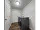 Convenient laundry room complete with modern washer and dryer and plenty of room at 8072 Crystal Ln, Douglasville, GA 30134