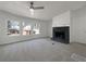 Inviting living room featuring a fireplace and ample natural light from large windows at 8072 Crystal Ln, Douglasville, GA 30134
