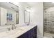 Beautiful bathroom with double vanity, marble countertops, and a tiled glass-enclosed shower at 1334 Wyntercreek Ln, Dunwoody, GA 30338