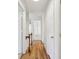 Second floor hallway with hardwood floors and white painted doors at 1334 Wyntercreek Ln, Dunwoody, GA 30338