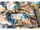Aerial view of a home with a backyard pool, patio, basketball court and surrounding neighborhood at 14 Long Island Pl., Atlanta, GA 30328