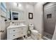 Bathroom featuring a white vanity, framed mirror, and glass enclosed shower at 14 Long Island Pl., Atlanta, GA 30328