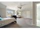 Bright bedroom with neutral walls, a ceiling fan, large windows, and carpet floors at 14 Long Island Pl., Atlanta, GA 30328