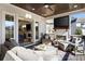 Stylish screened-in porch with outdoor furniture and an outdoor television at 14 Long Island Pl., Atlanta, GA 30328