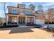 Charming two-story brick home with a welcoming front porch and well-manicured lawn, exuding curb appeal at 14 Long Island Pl., Atlanta, GA 30328