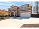 Beautiful brick home with a spacious driveway and attached two-car garage, offering both style and functionality at 14 Long Island Pl., Atlanta, GA 30328