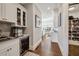 Hallway bar featuring wine storage, beverage cooler and bar sink at 14 Long Island Pl., Atlanta, GA 30328