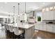 Bright kitchen with a large center island, breakfast bar, and stainless steel vent hood at 14 Long Island Pl., Atlanta, GA 30328