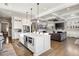 Bright kitchen with a large island, stainless steel appliances, and open layout to the living room at 14 Long Island Pl., Atlanta, GA 30328
