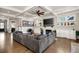 Inviting living room with a fireplace, built-ins, and a comfortable sectional sofa at 14 Long Island Pl., Atlanta, GA 30328
