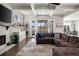 Comfortable living room with fireplace, built-in shelving and French doors leading to the screened porch at 14 Long Island Pl., Atlanta, GA 30328