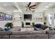 Cozy living room with a fireplace, built-in shelving, and a large comfortable sectional at 14 Long Island Pl., Atlanta, GA 30328